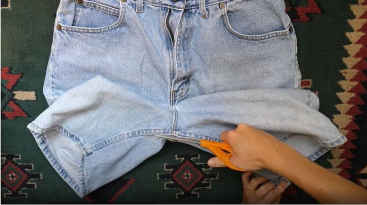 turn a pair of old jeans into a fun new skirt, Cut the crotch seam
