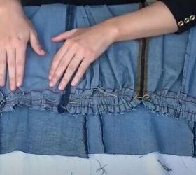 learn how to make a button up a line skirt from jeans, Remove the yarn