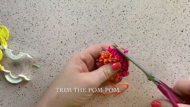 create an adorable pom pom keychain with this easy tutorial, Trim your DIY pom pom