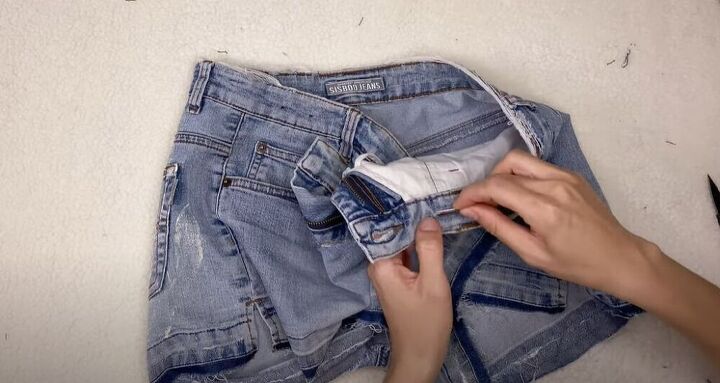 how to take in and style up a pair of jean shorts, Sew around the buttonhole