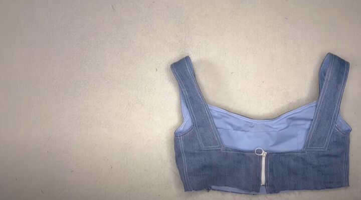 learn to make the cutest crop top from an old pair of jeans, Sew on the zipper