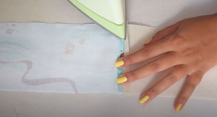 learn how to sew an adorable mini pouch for face masks, Press the fabric