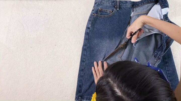 turn some frumpy jean shorts into a hip distressed asymmetrical skirt, DIY jean skirt