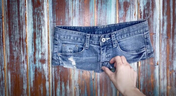 how to make jeans high waisted turning low rise into diy high rise, Cut off the bottom of the zipper flap