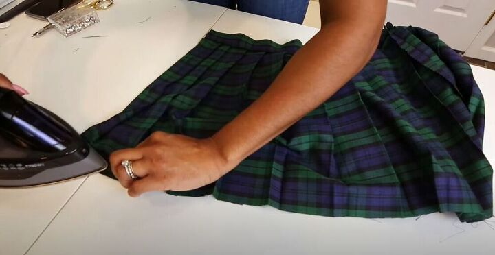 check out this diy plaid skirt revamp, Press the hem