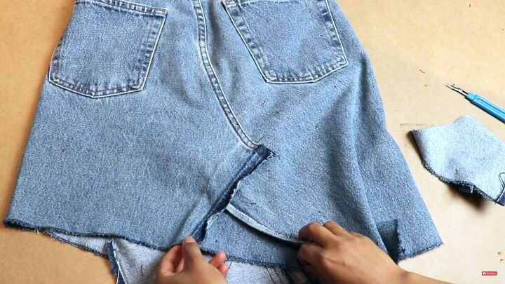 make a unique diy denim skirt that looks store bought, Cut out back insert