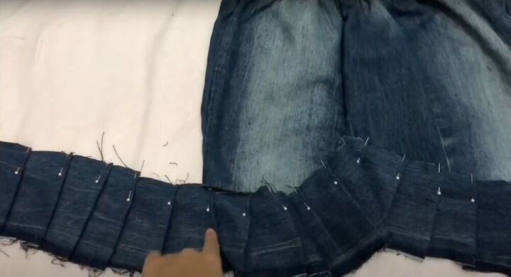 how to transform old jeans into a diy denim skirt, Fold the fabric