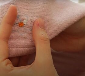 how to upcycle an old zip up into an adorable embroidered sweater, Make stitches from edge to center