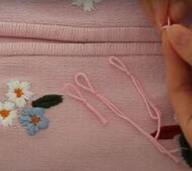 how to upcycle an old zip up into an adorable embroidered sweater, Loops to fasten the buttons