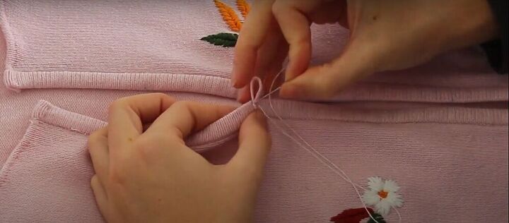 how to upcycle an old zip up into an adorable embroidered sweater, Sew on the loops