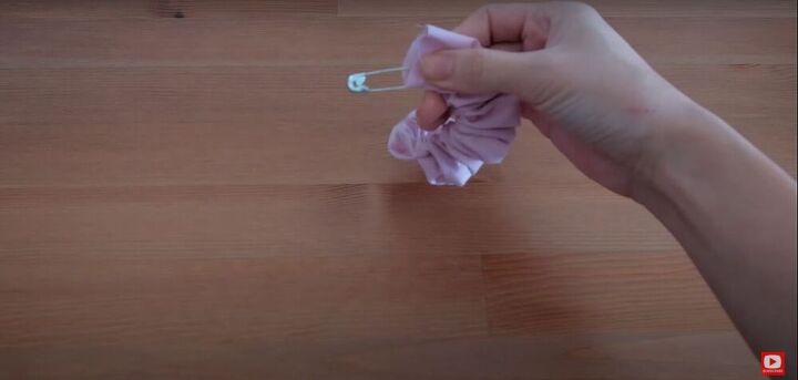 quick diy bow scrunchies to make with scrap fabric, Pull the elastic to the other end