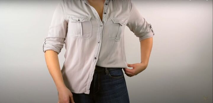 how to tuck in a shirt tips and tricks to elevate your look, Pull some fabric out on the side