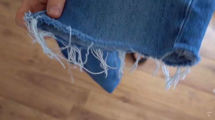 how to cut jeans into shorts in just 6 easy steps, Frayed edges of the DIY jean shorts