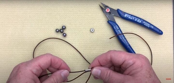 bohemian jewelry tutorial featuring leather necklace knots, Insert the cord into the tube