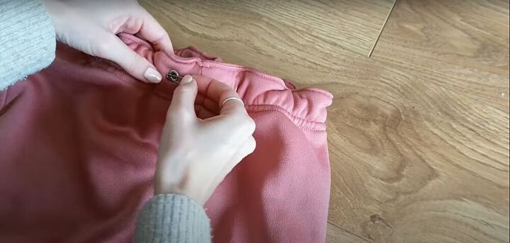 how to make sew an easy sweatpants pattern with pockets, Pull the drawstring through the waistband