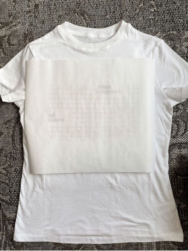 how to make a t shirt with cricut s infusible ink, Here I have the butcher paper on the shirt ready for the Easy Press