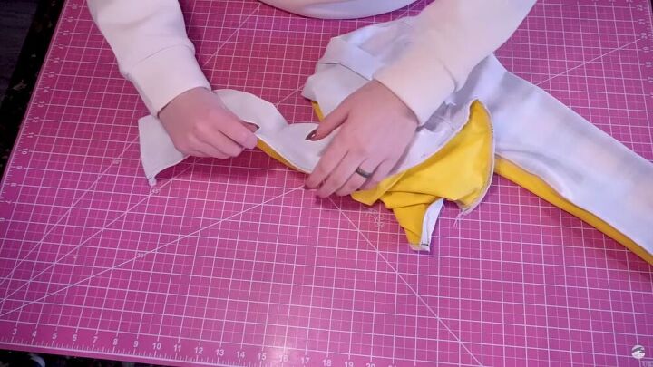 how to make a cropped rash guard with long sleeves, Breaking the basting stitches