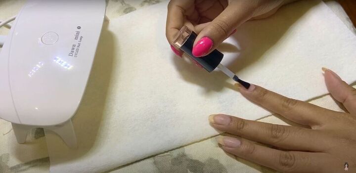 try this easy cherry blossom nail art to create blissful sakura nails, Applying a base coat
