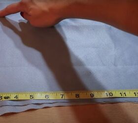 how to make a fabulous a line skirt out of an abandoned curtain, Measuring the bottom of the A line skirt