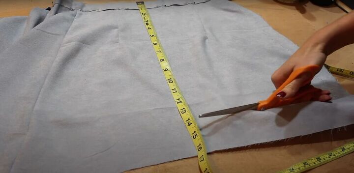 how to make a fabulous a line skirt out of an abandoned curtain, Trimming the bottom of the skirt