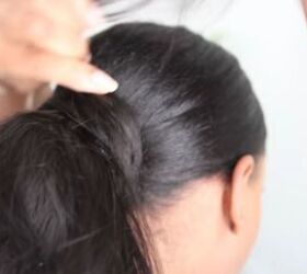 how to do a fierce sleek ponytail on natural hair using bundles, Wrapping the tracks of the sleek low pony