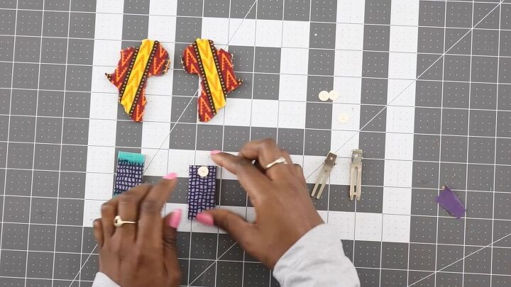how to make creative fabric covered wood earrings from scraps, Pressing the post onto the earring