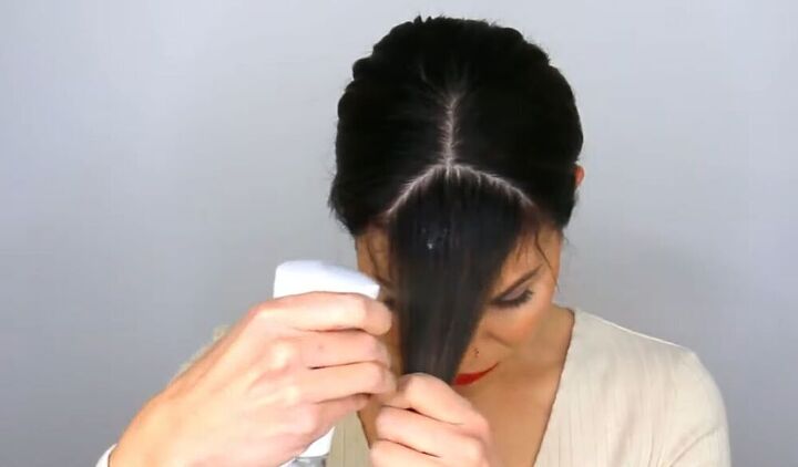 hairdresser hack how to cut and style curtain bangs to look cute, Wetting hair ready to cut it