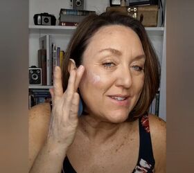 how to cover up sun spots with makeup tutorial for mature skin, Applying illuminator to my face