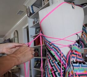 this astonishing diy crochet dress was actually made from old blankets, Braiding the yarn hanging off the DIY crochet dress