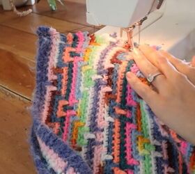 this astonishing diy crochet dress was actually made from old blankets, Using a sewing machine to quickly stitch the edges