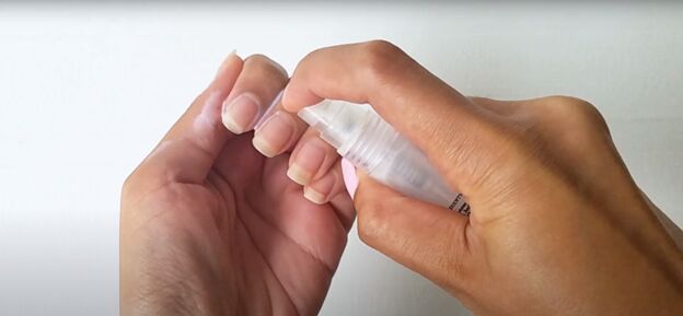 easy at home manicure how to cure gel nail polish with an led light, Using a cuticle spray