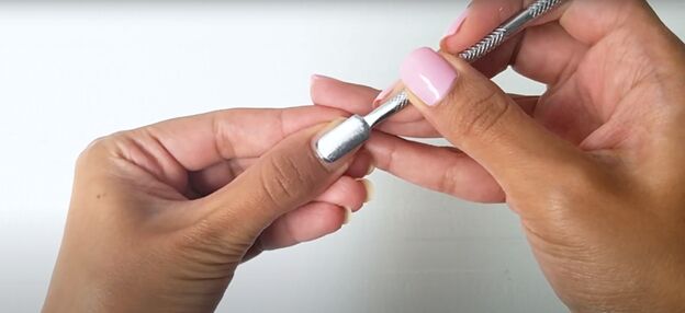 easy at home manicure how to cure gel nail polish with an led light, Pushing back cuticles