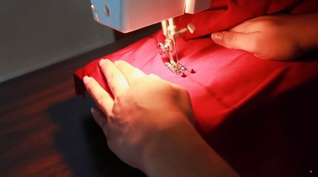 how to turn a dress into a skirt tube top with sexy 90s vibes, Sewing the side seams of the skirt