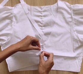 make this cute puff sleeve crop top out of an old men s shirt, Attaching a strip of fabric to the hem