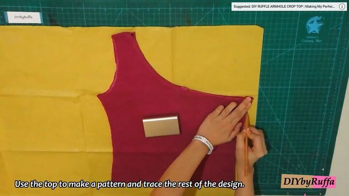 how to make a funky diy patchwork top from two old t shirts, Tracing the asymmetric top onto paper