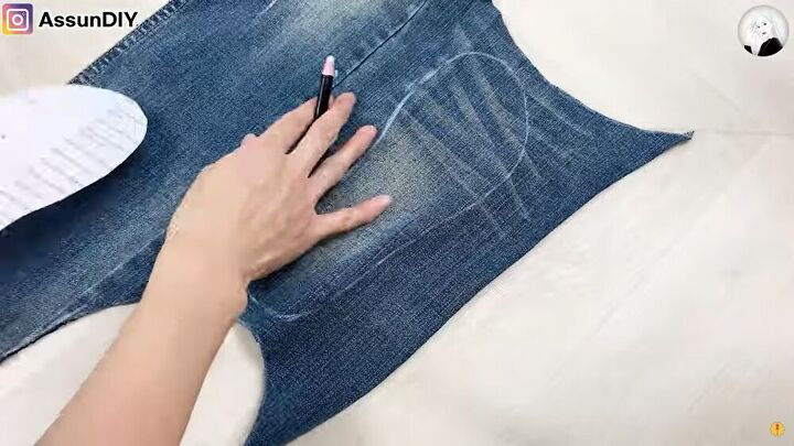 how to turn old flip flops jeans into cute diy denim sandals, Cutting out the inside of the denim sandals