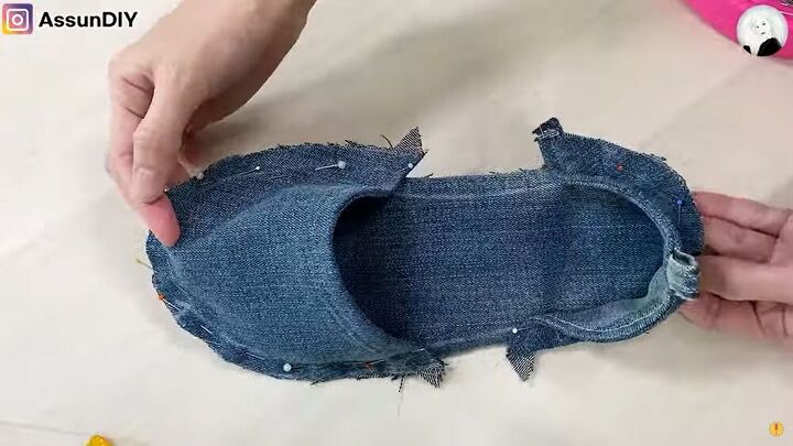 how to turn old flip flops jeans into cute diy denim sandals, The denim sandal pinned in place