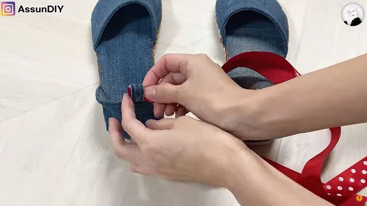 how to turn old flip flops jeans into cute diy denim sandals, Threading the ribbon through the shoe loops