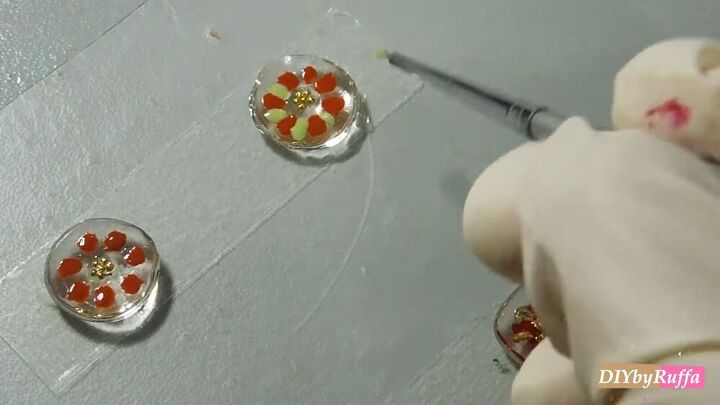 have you tried making resin earrings check out this diy tutorial, Adding green petals to the design