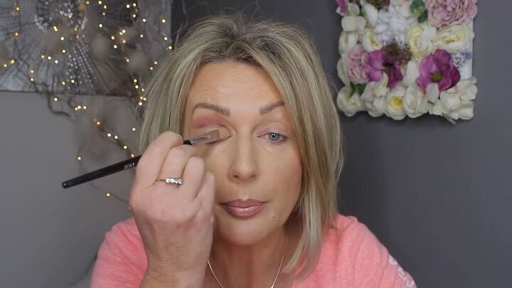 easy step by step makeup for mature hooded eyes, Applying a light color eyeshadow to the lid