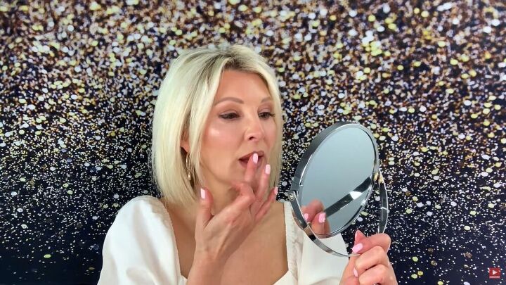 want to know how to stop lipstick from smudging try this simple trick, Applying highlighter to lips