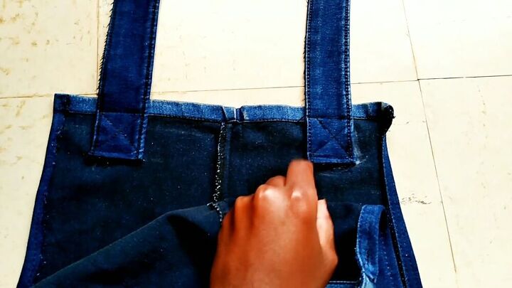 how to easily make a dungaree dress from old jeans, Criss cross stitching on the straps