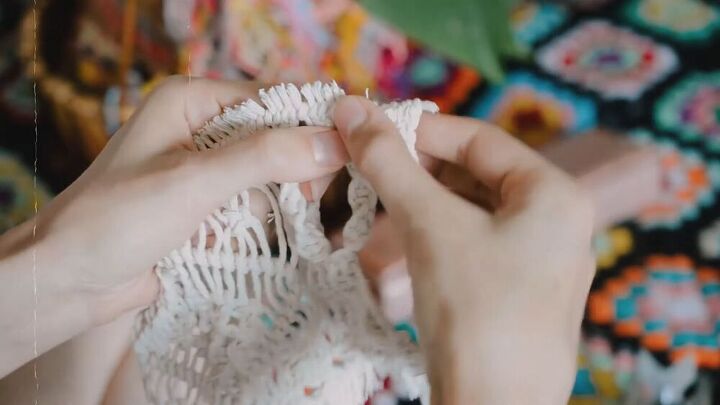 use this relaxing diy macrame purse tutorial to make a unique bag, Folding the raw edges of the macrame piece