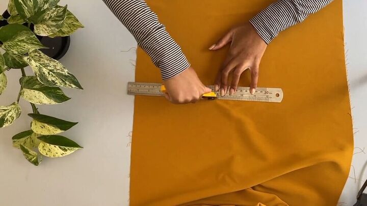 how to make a sexy satin diy cowl neck top, Cutting fabric with a rotary cutter