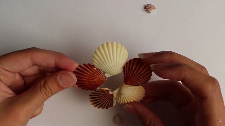4 diy seashell hair clip ideas that will release your inner mermaid, Gluing the seashells together with hot glue
