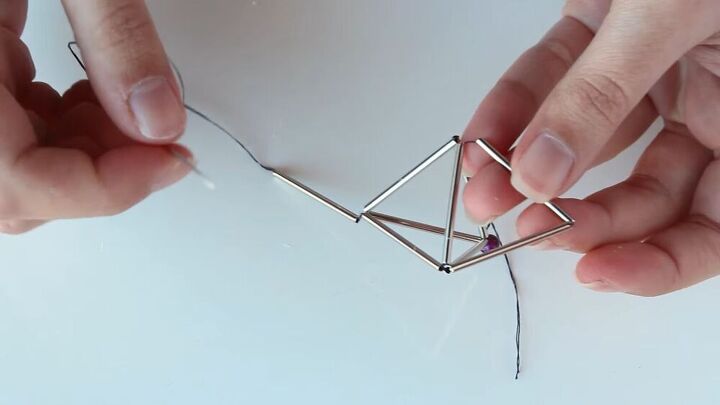 this diy geometric necklace is cool simple so easy to make, Threading one more tube onto the nylon