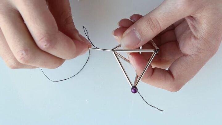 this diy geometric necklace is cool simple so easy to make, Threading through the tubes to make it sturdy