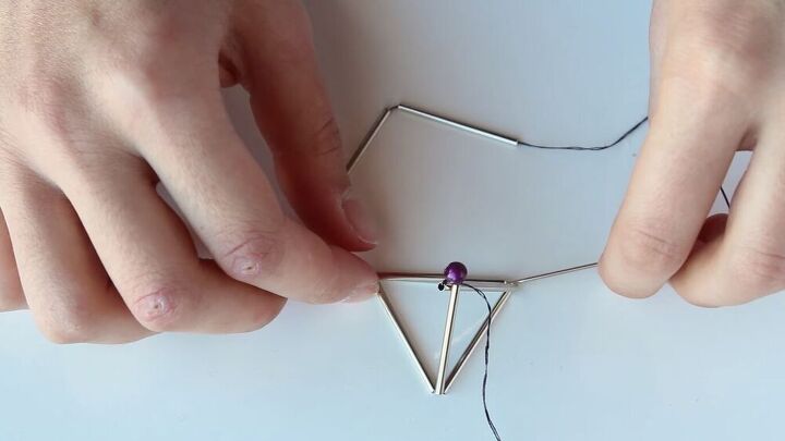 this diy geometric necklace is cool simple so easy to make, Feeding the needle into the triangle base