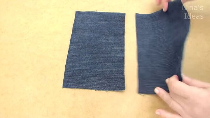 got an old pair of jeans turn them into a cute diy denim clutch, Folding the denim fabric