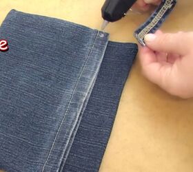 got an old pair of jeans turn them into a cute diy denim clutch, Gluing the belt loop onto the denim clutch